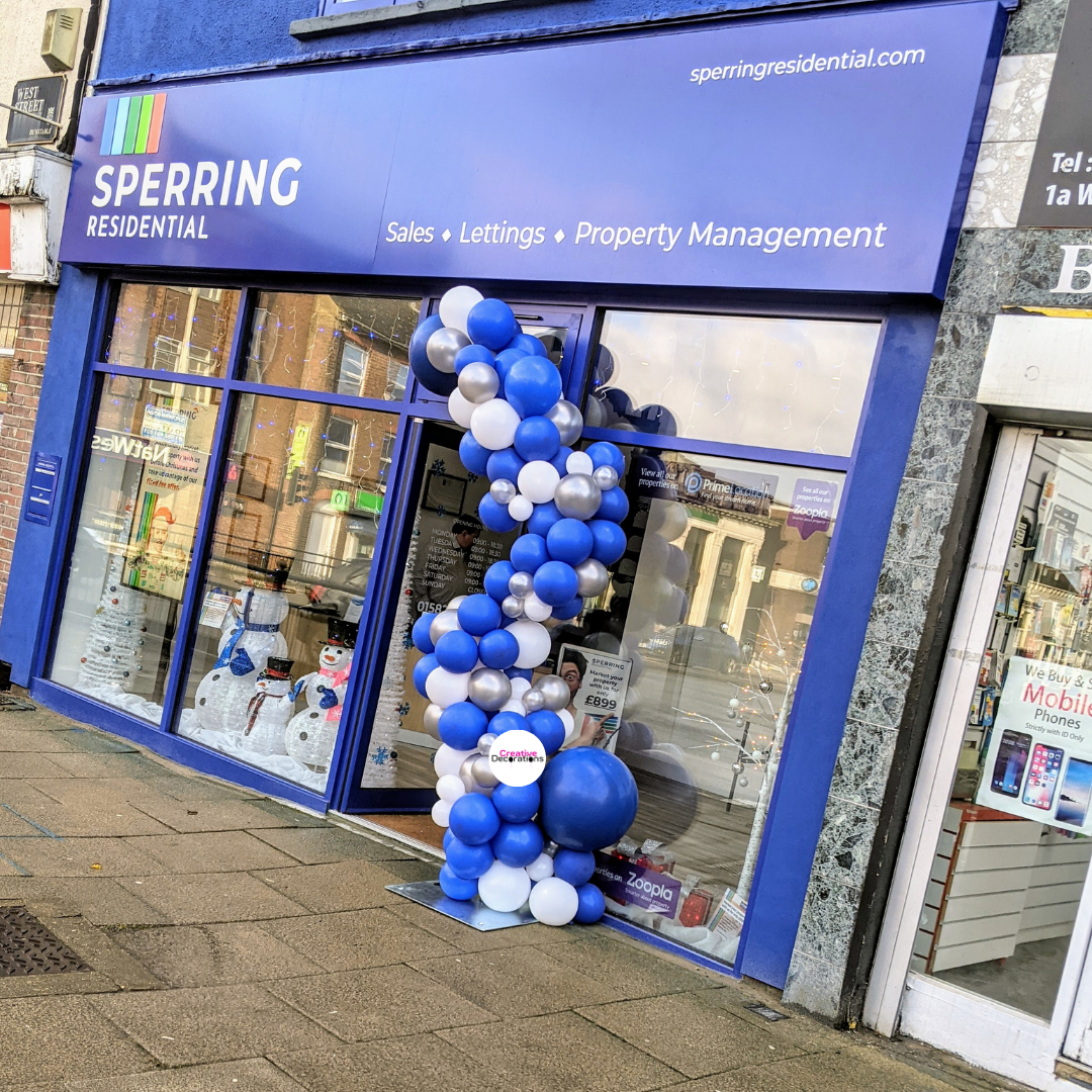 Blue and white balloon garland for a shop opening