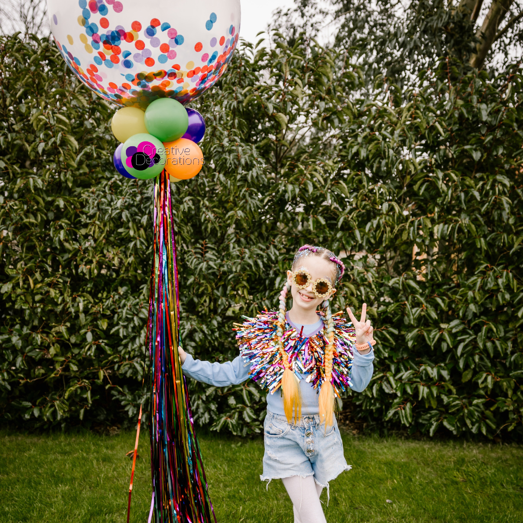 A first birthday number display with mini foil animal balloons